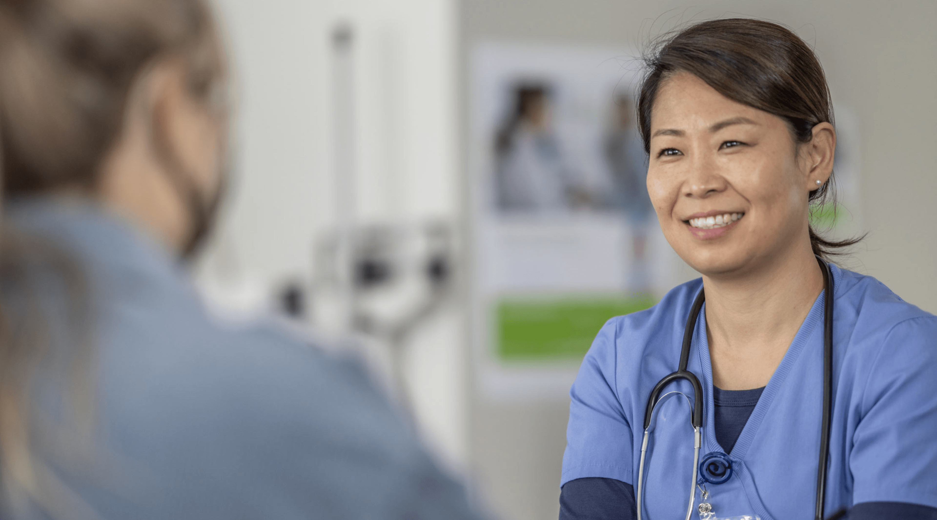 Image of a healthcare worker speaking with a patient.